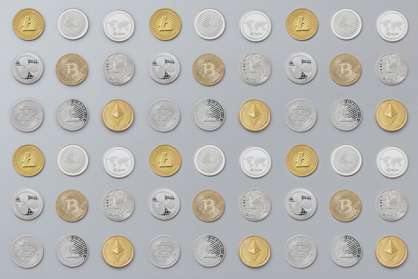 A seamless pattern of various cryptocurrency coins in gold and silver tones.
